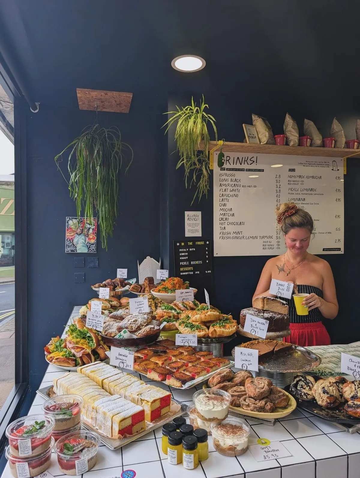 Denisa behind the counter with the morning bake display at The Pickle Kemptown