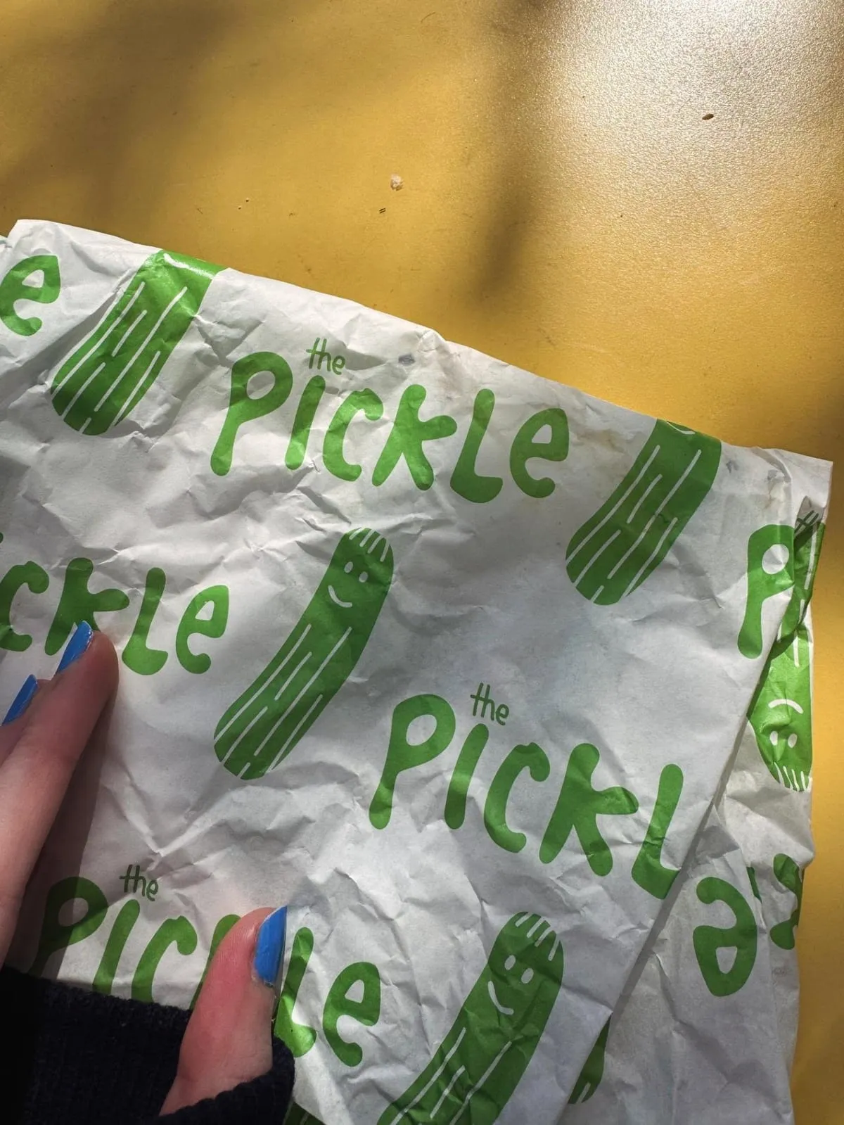The Pickle's green pickle-print sandwich wrapping paper, Brighton